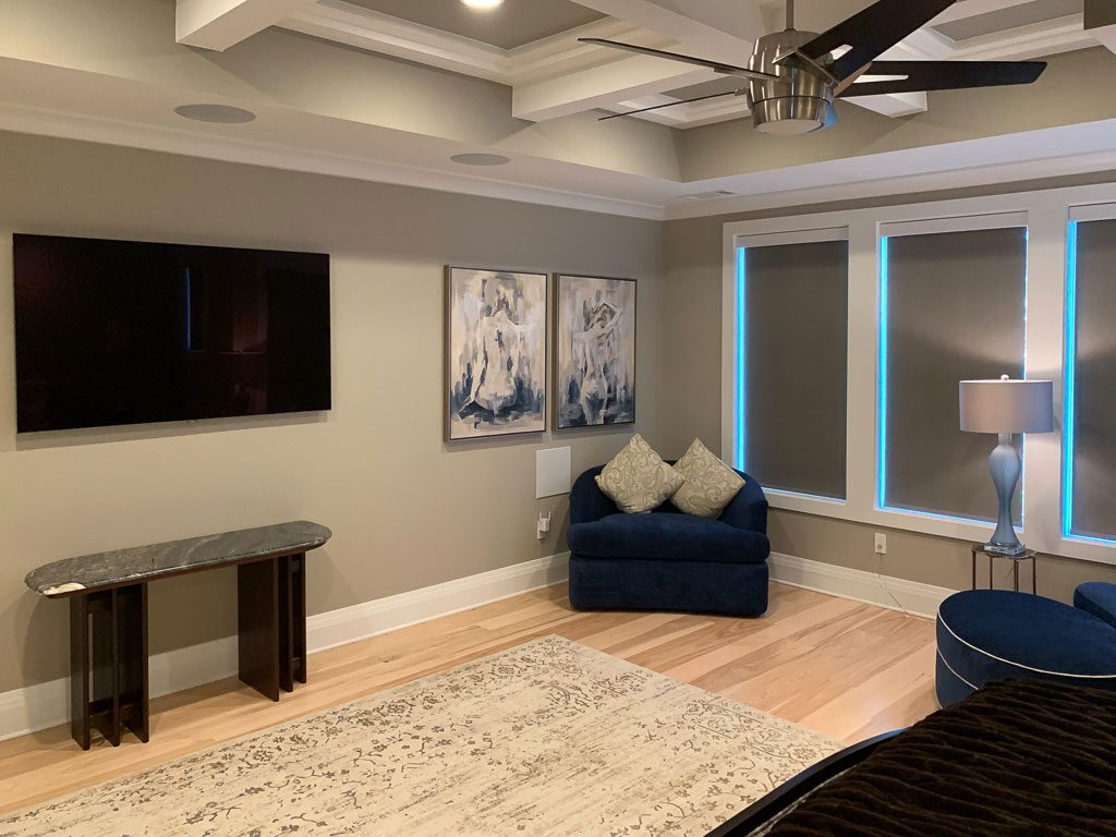 blackout-shades-triple-television-subwoofer-and-ceiling-speakers bedroom